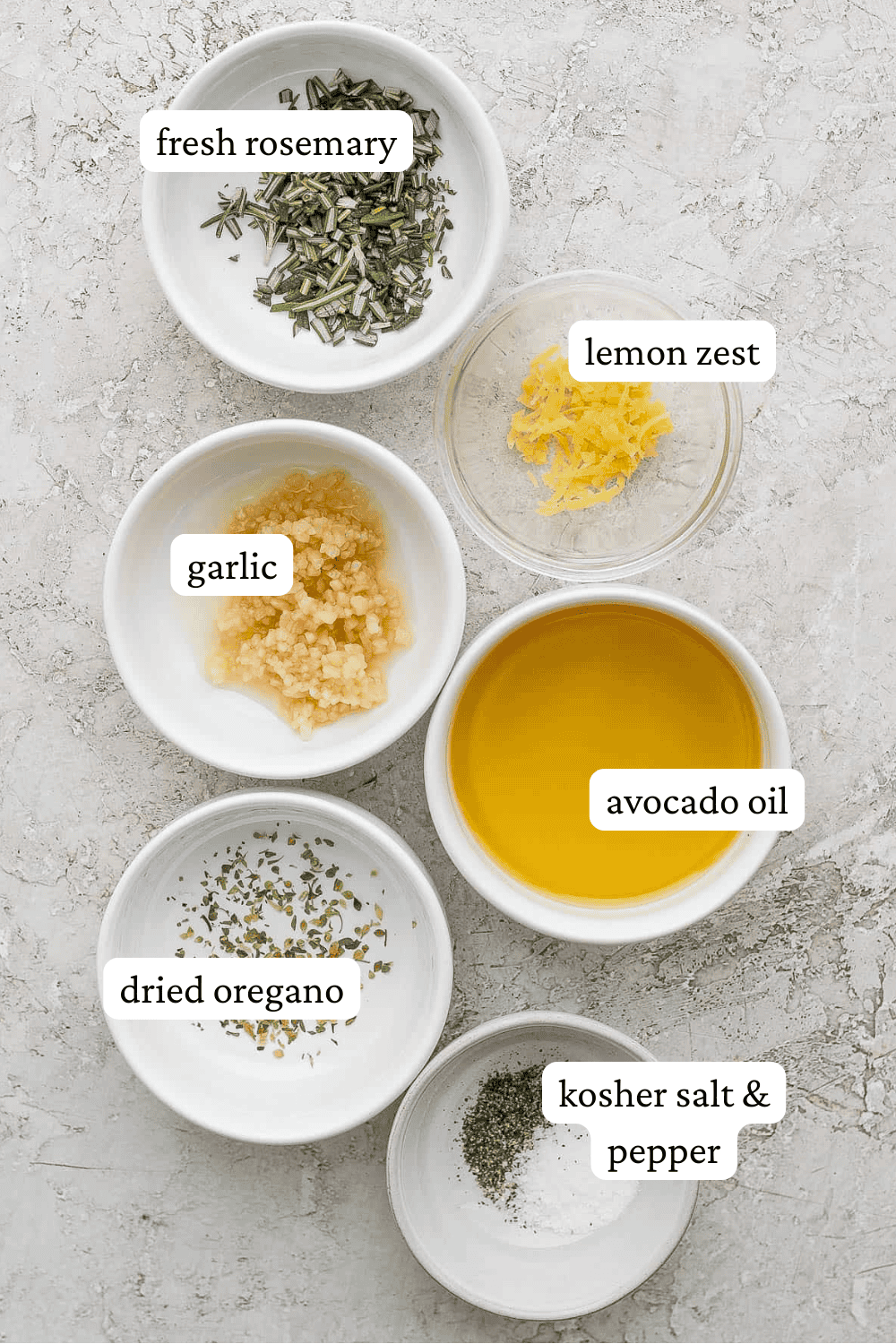 Lamb marinade ingredients in separate bowls with labels.