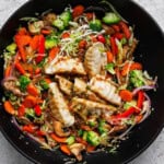 Pot sticker stir fry in a large wok.