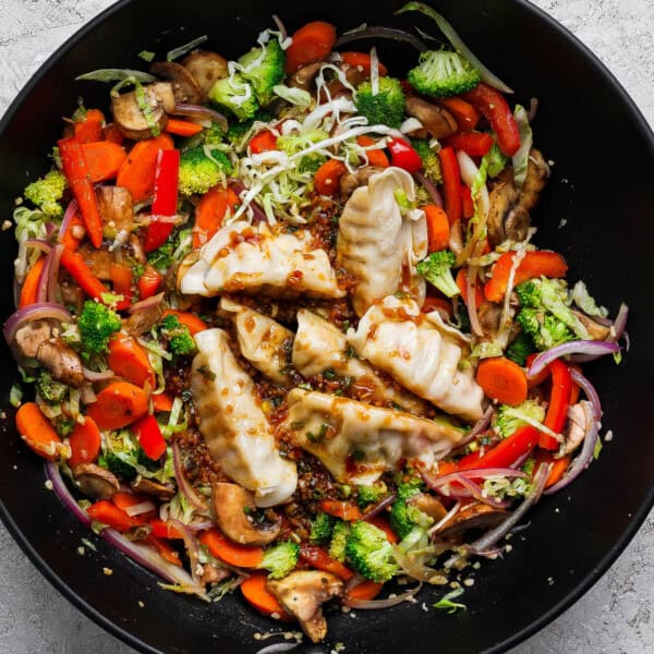 Pot sticker stir fry in a large wok.