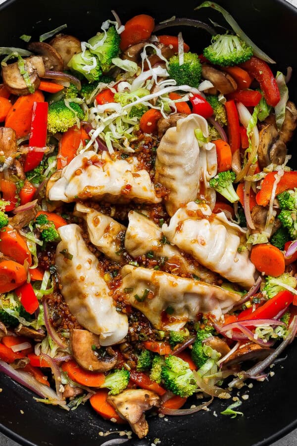 Pot sticker stir fry in a large wok.