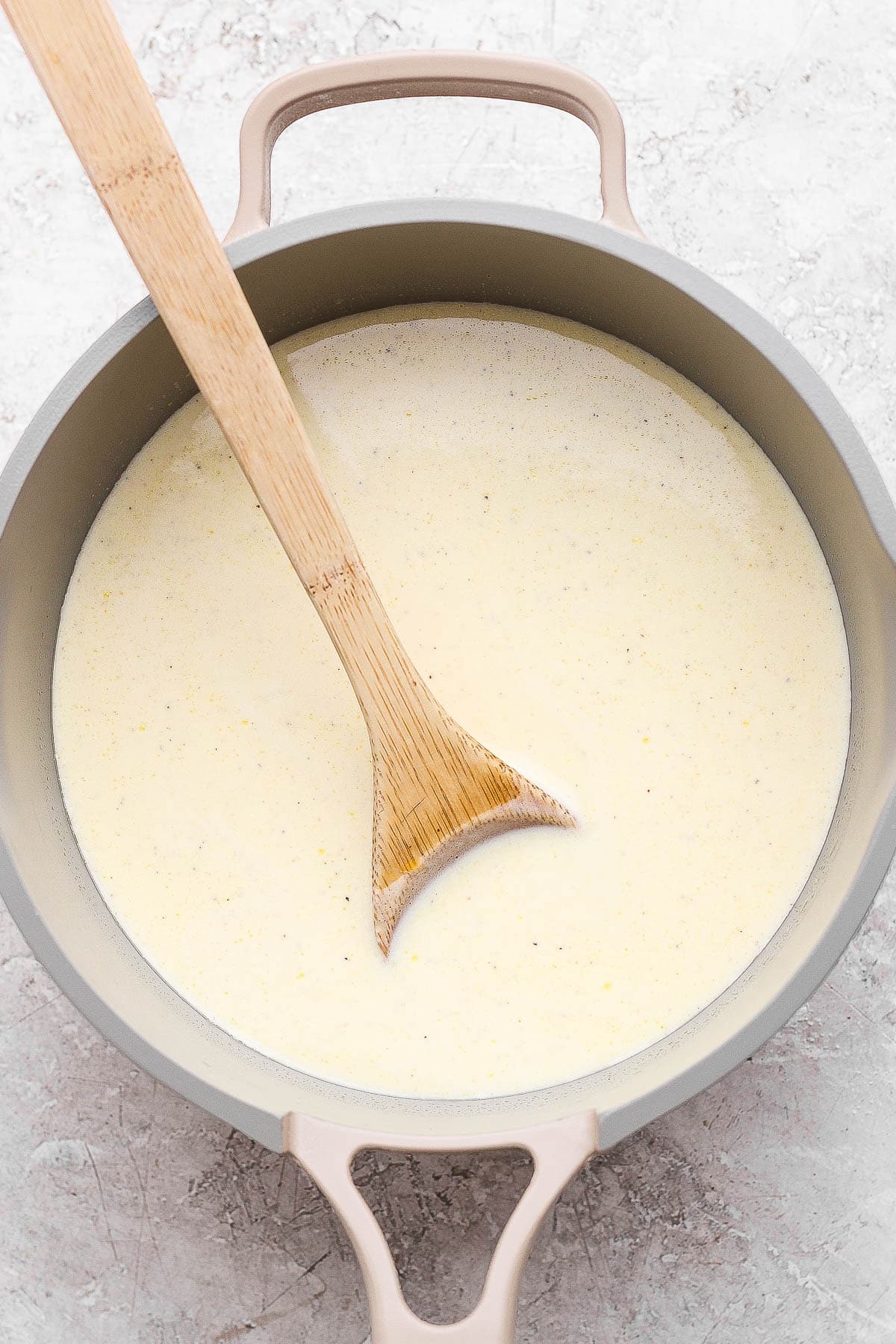 A roux in a sauce pan to add cheesiness to sheet pan soup.