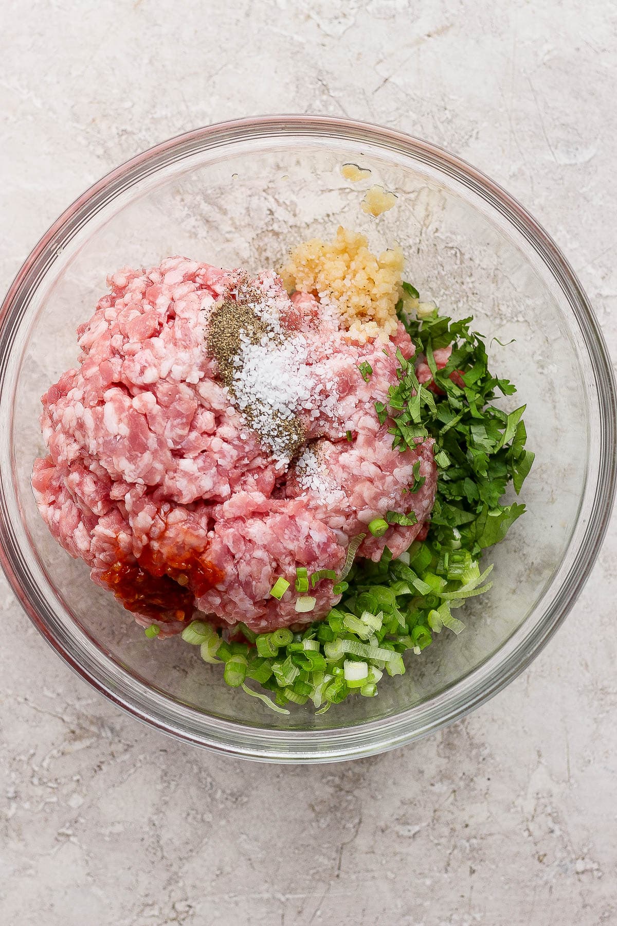 The pork mixture ingredients for smash dumpling tacos before being mixed together.