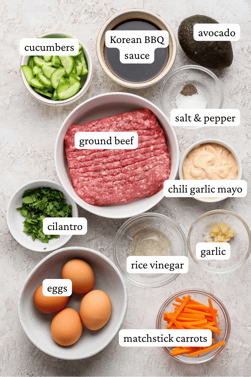 Ingredients for Korean bbq bowls in separate bowls with labels.