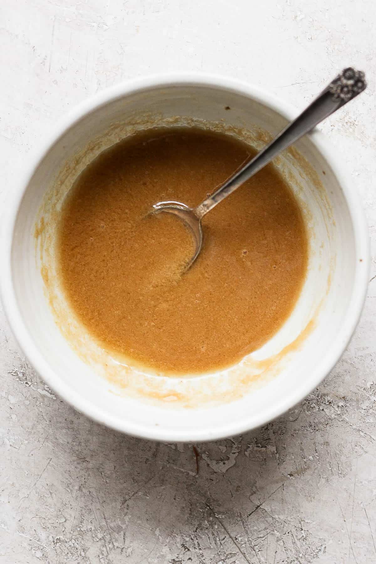 A fully mixed ham glaze in a bowl before going on an Instant Pot ham.