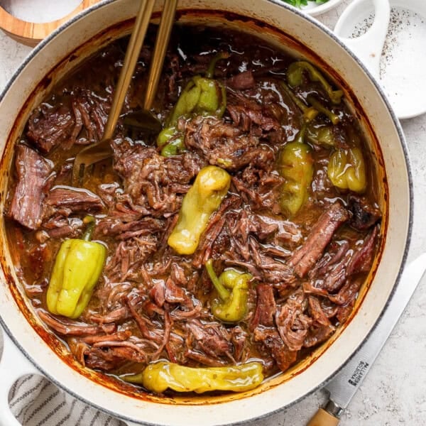A Dutch Oven filled with cooked Mississippi Pot Roast.