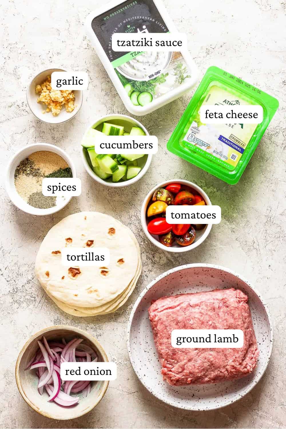 Ingredients for ground lamb tacos in separate bowls and containers with labels.