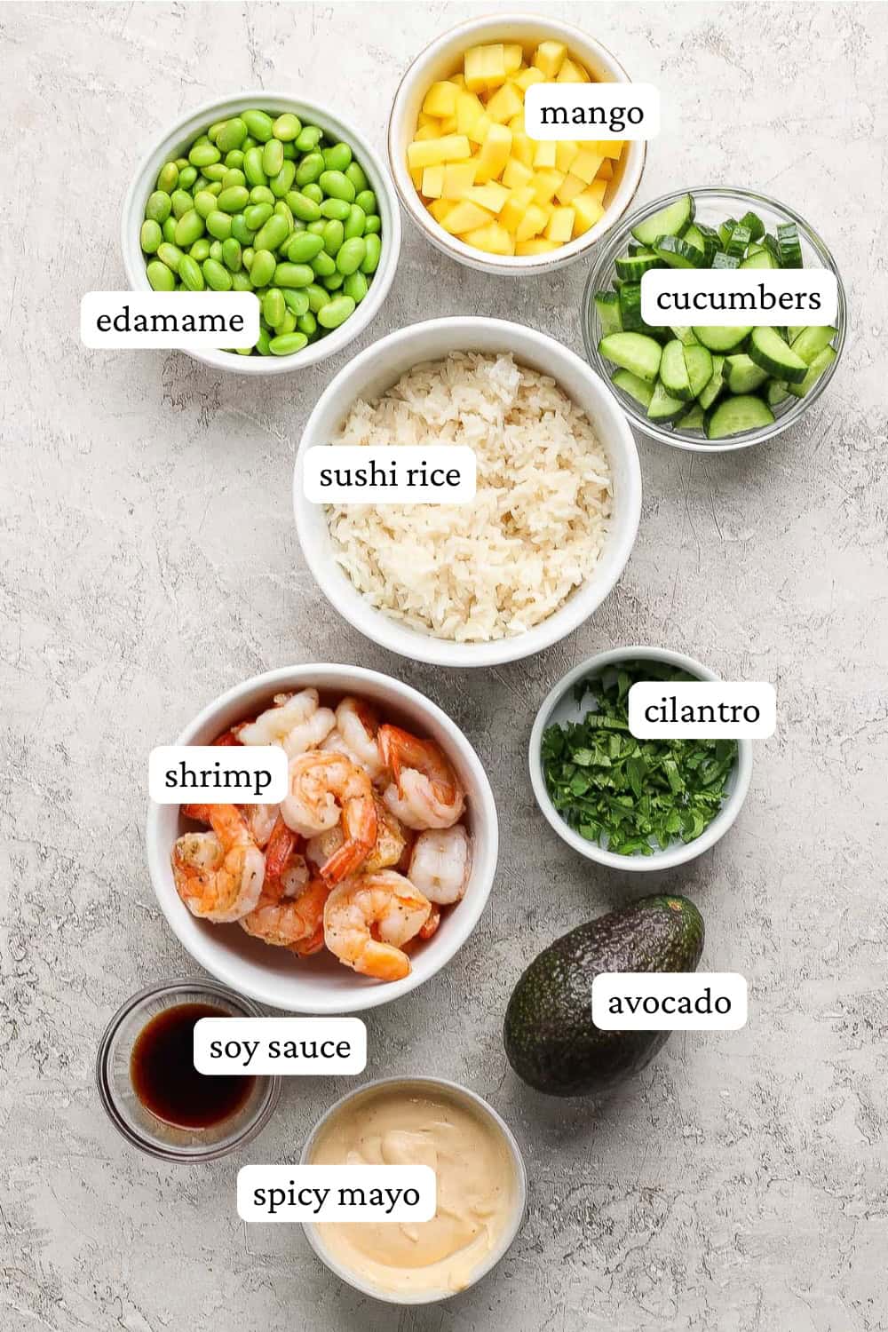 Ingredients for shrimp sushi bowls in separate bowls with labels.