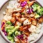 Bang bang chicken rice bowl fully assembled in a large bowl.