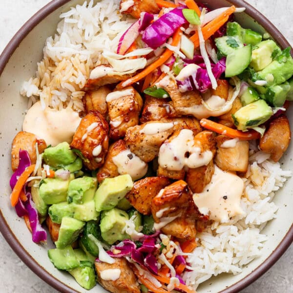 Bang bang chicken rice bowl fully assembled in a large bowl.