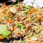Blackstone egg roll in a bowl on the Blackstone cooktop.