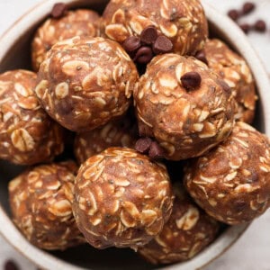 Several chocolate peanut butter energy balls in a bowl.
