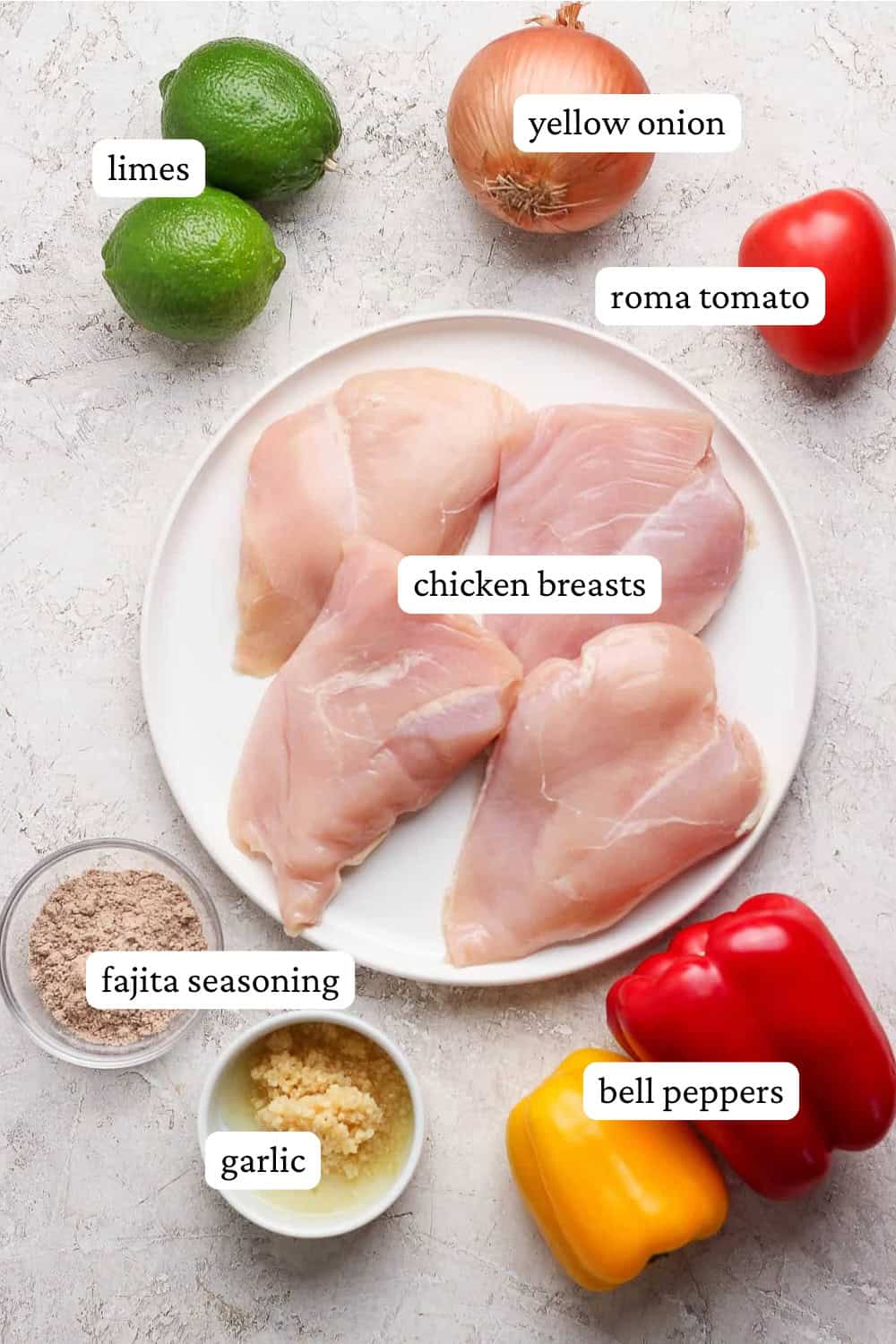 Ingredients for slow cooker chicken fajitas in bowls, plates, and on the counter with labels.