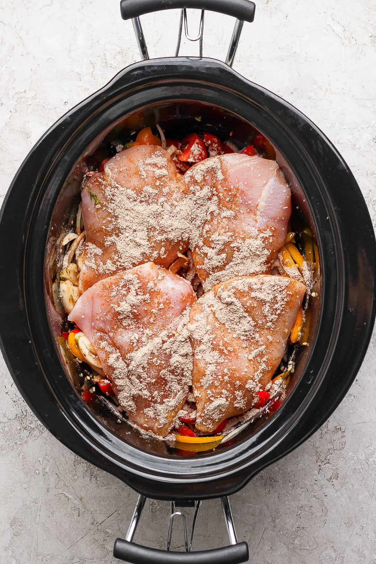 Slow cooker chicken fajitas before cooking.