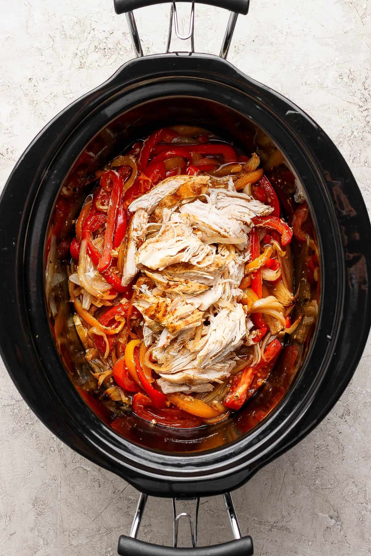 Slow cooker chicken fajitas with the chicken shredded and returned to the crock pot.