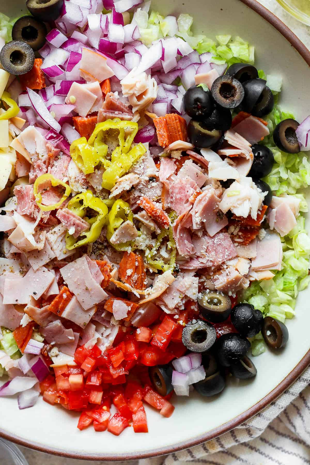 An Italian sub in a tub in a large serving bowl.