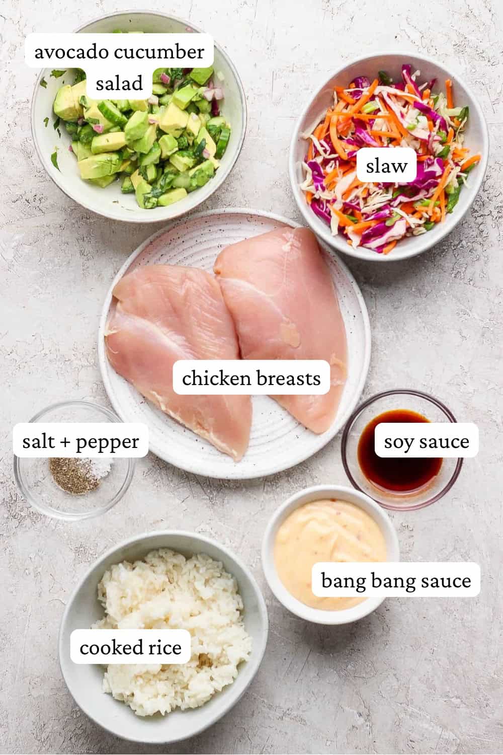 Bang bang chicken bowl ingredients in separate bowls with labels.