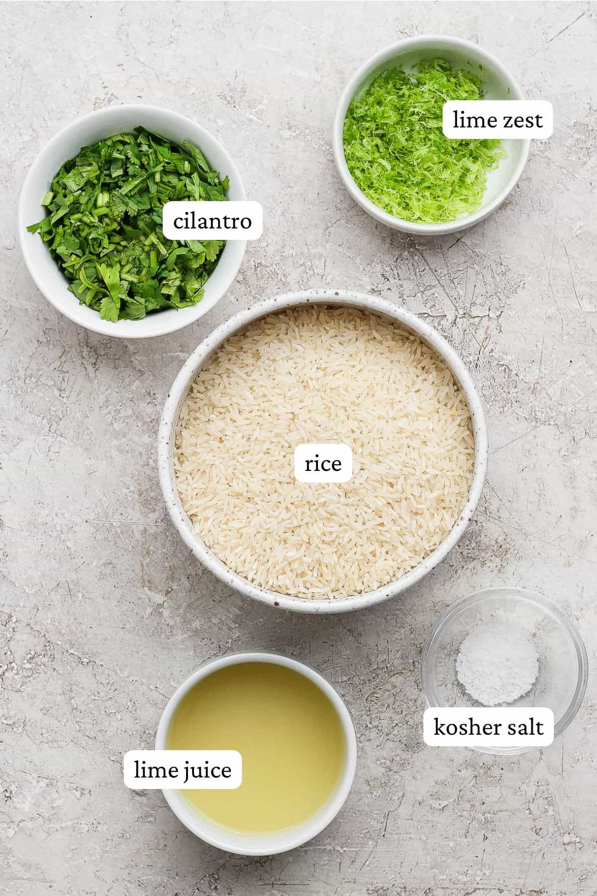 Cilantro lime rice ingredients in separate bowls with labels.