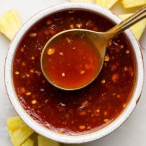 Pineapple teriyaki sauce in a bowl with a spoon