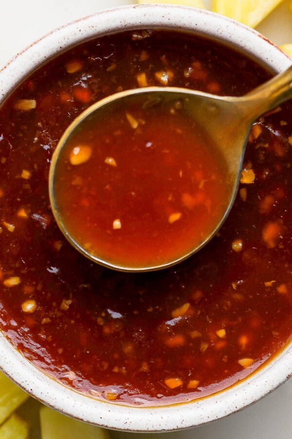 Pineapple teriyaki sauce in a bowl with a spoon