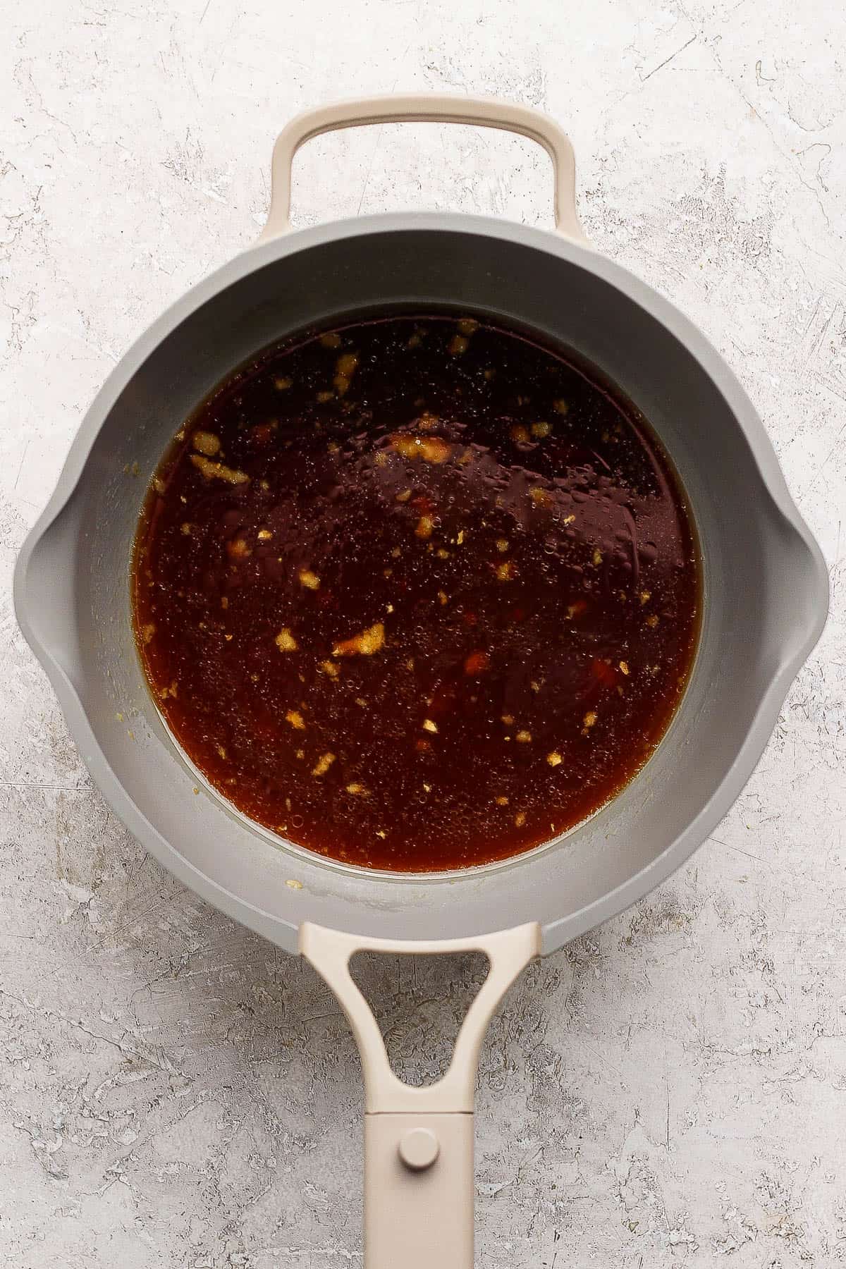 Pineapple teriyaki sauce ingredients in a sauce pan.