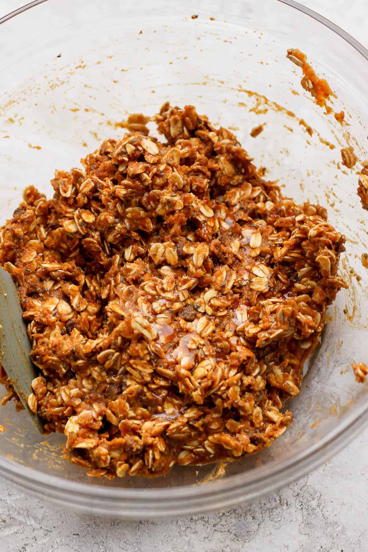 Pumpkin energy ball ingredients mixed together in a mixing bowl.