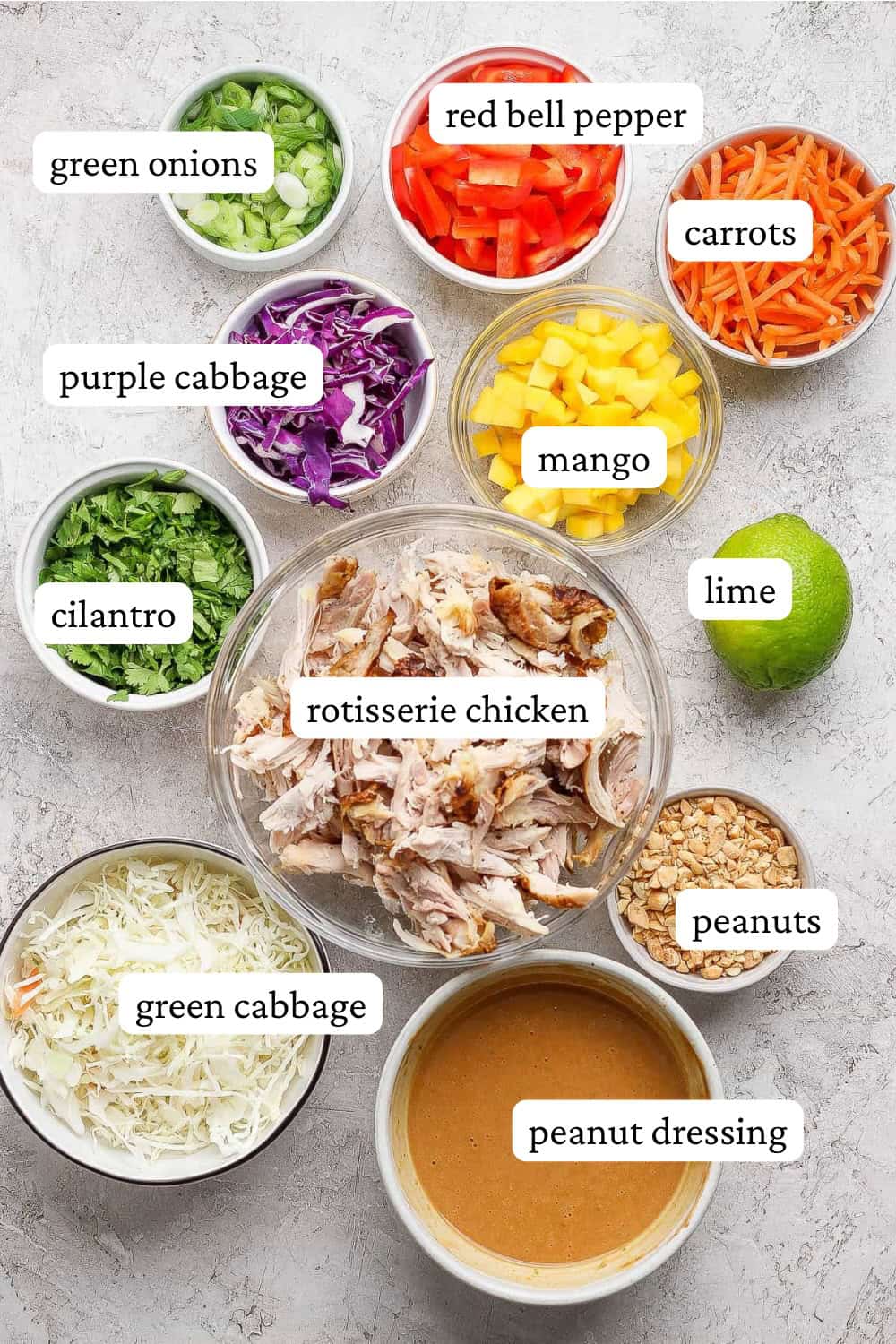 Thai peanut rotisserie chicken salad ingredients in separate bowls with labels.