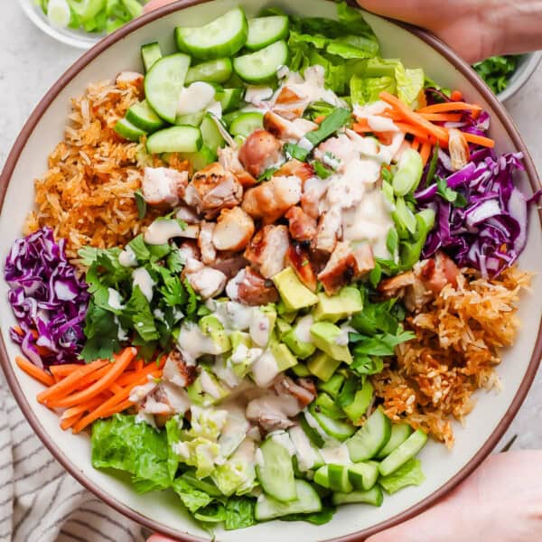Bang bang chicken salad with crispy rice in a serving bowl.