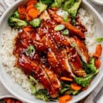 Blackstone teriyaki chicken over rice in a large white bowl.