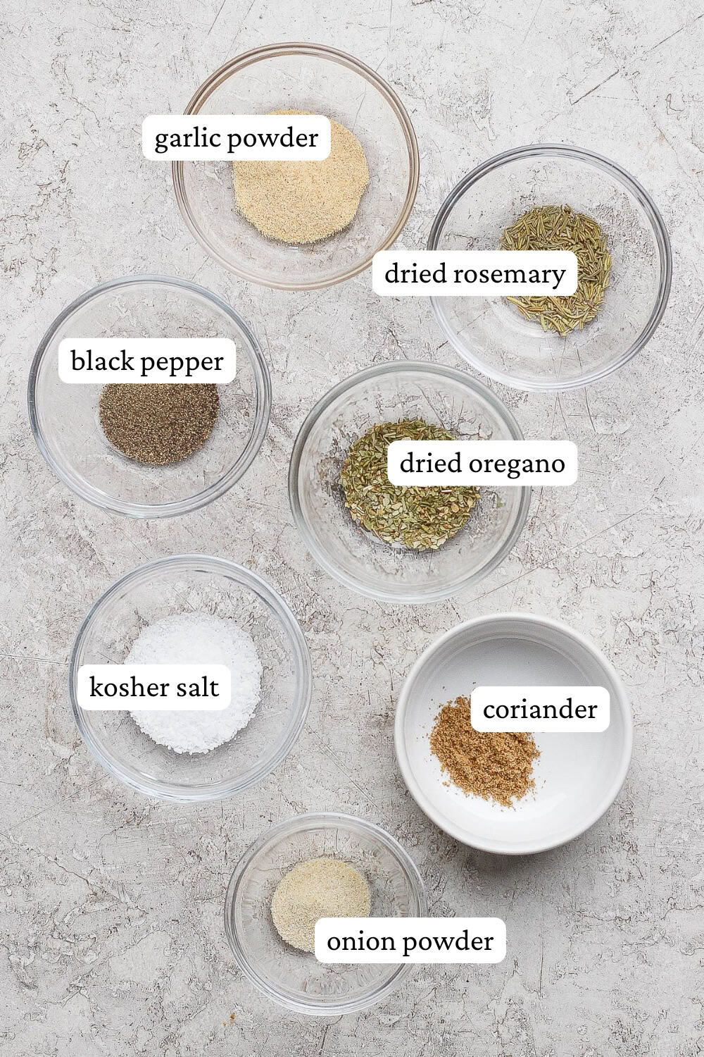 Lamb seasoning ingredients in separate bowls with labels.