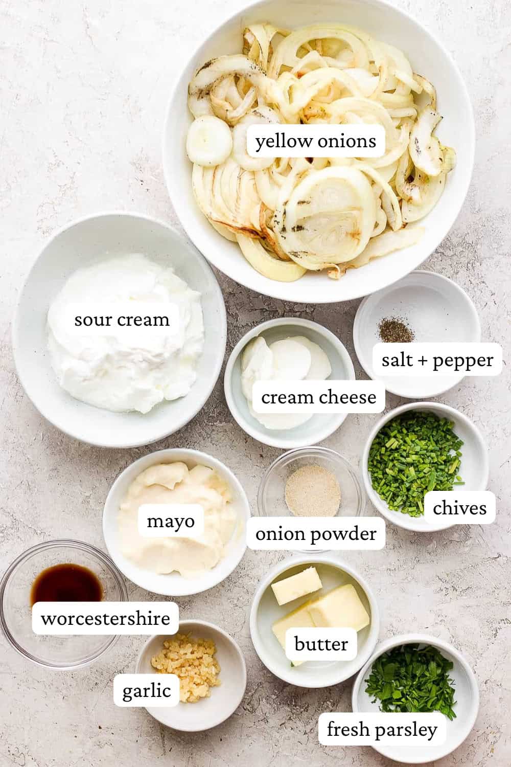 Ingredients for smoked onion dip in separate bowls with labels.