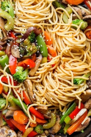 Veggie lo mein in a cast iron skillet.