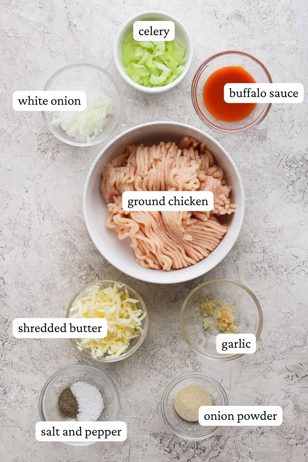 Ingredients for buffalo chicken burgers in separate bowls with labels.