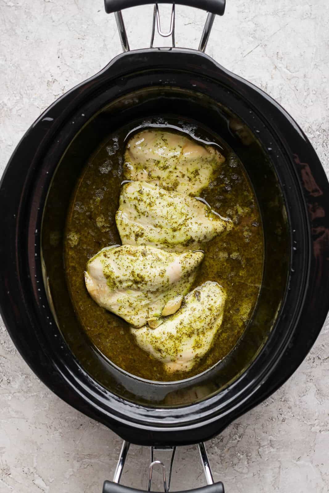 Fully cooked crockpot cilantro lime chicken in the crockpot before shredding.