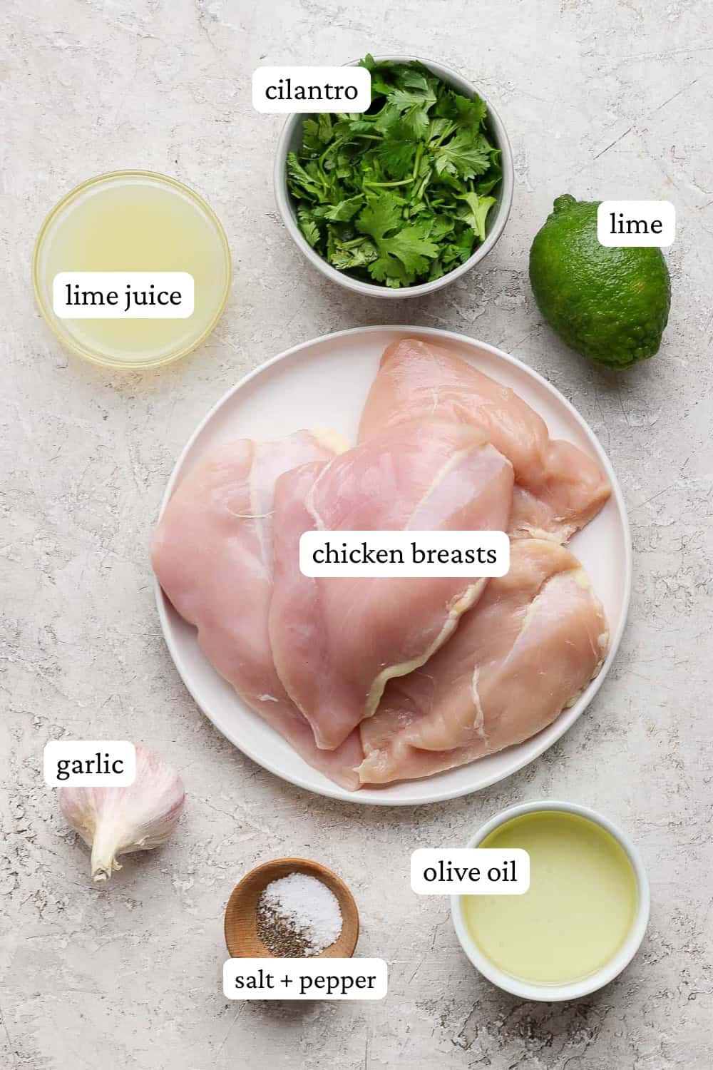Ingredients for crockpot cilantro lime chicken in bowls with labels.