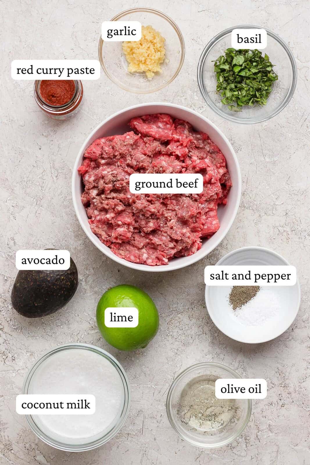 Ingredients for red curry meatballs in separate bowls with labels.