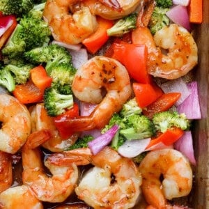 Sheet pan shrimp dinner fully cooked on a baking sheet.