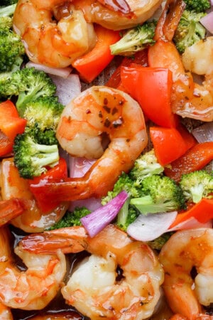 Sheet pan shrimp dinner fully cooked on a baking sheet.