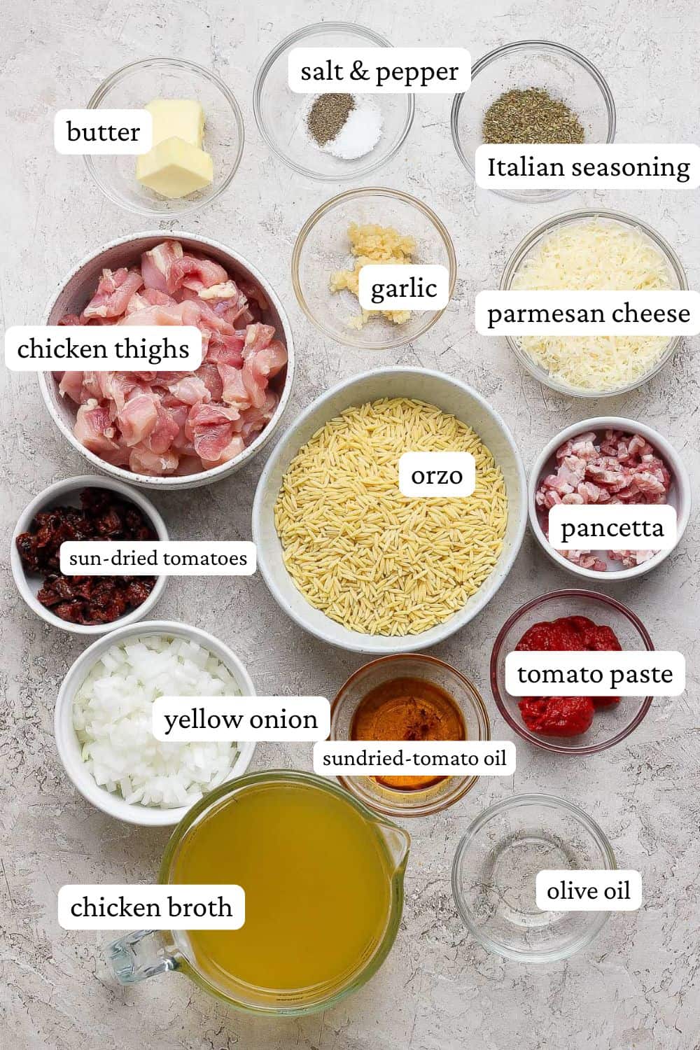 Marry me chicken ingredients of butter kosher salt, pepper, Italian seasoning, garlic, chicken thighs, parmesan cheese, orzo, sun dried tomatoes, pancetta, yellow onion, sun-dried tomato oil, tomato paste, chicken broth, and olive oil.