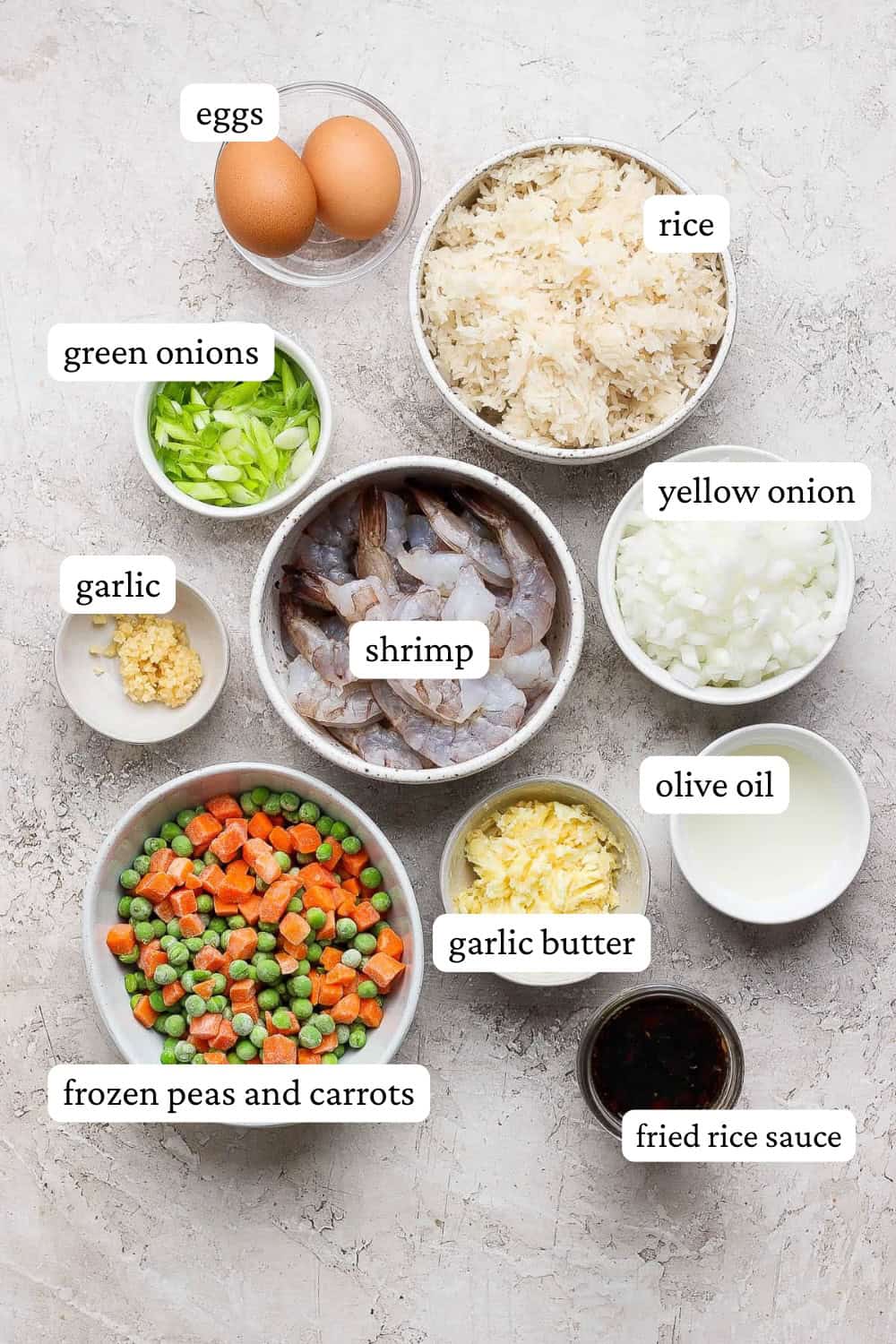 Blackstone shrimp fried rice ingredients in separate bowls with labels.