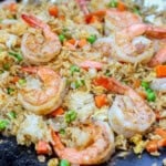 Blackstone shrimp fried rice cooking on the hot griddle.