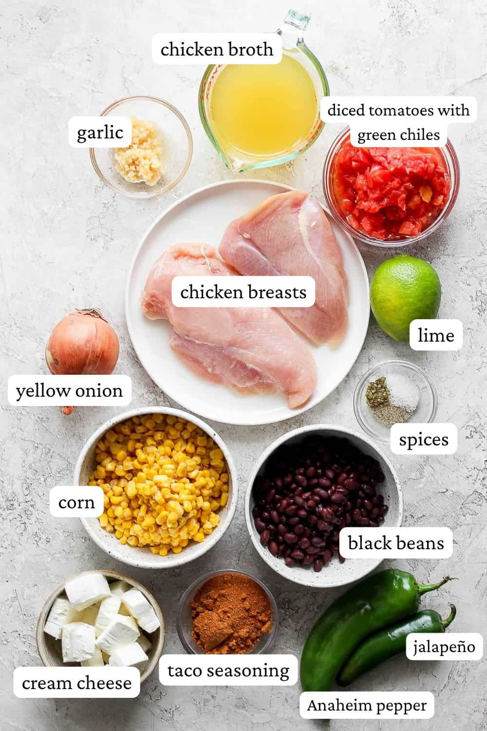 Ingredients for chicken taco soup in bowls with labels.