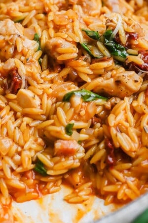 Marry me chicken orzo fully cooked in the pan.