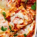 Million dollar ravioli casserole with a fork in the side.