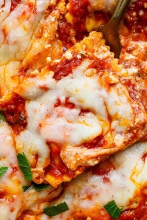Million dollar ravioli casserole with a fork in the side.