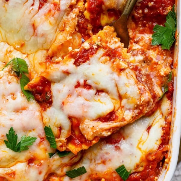 Million dollar ravioli casserole with a fork in the side.