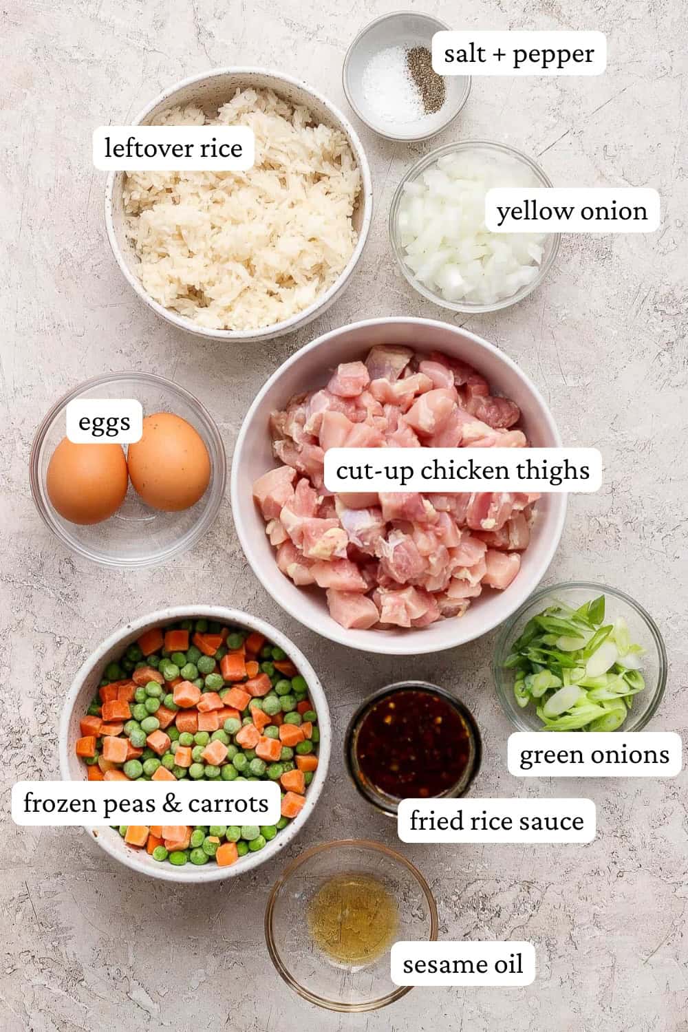 Sheet pan fried rice ingredients in separate bowls with labels.
