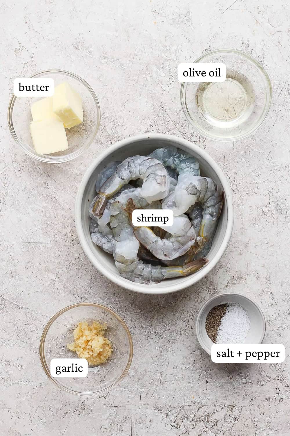Shrimp on the blackstone ingredients in small bowls with labels.