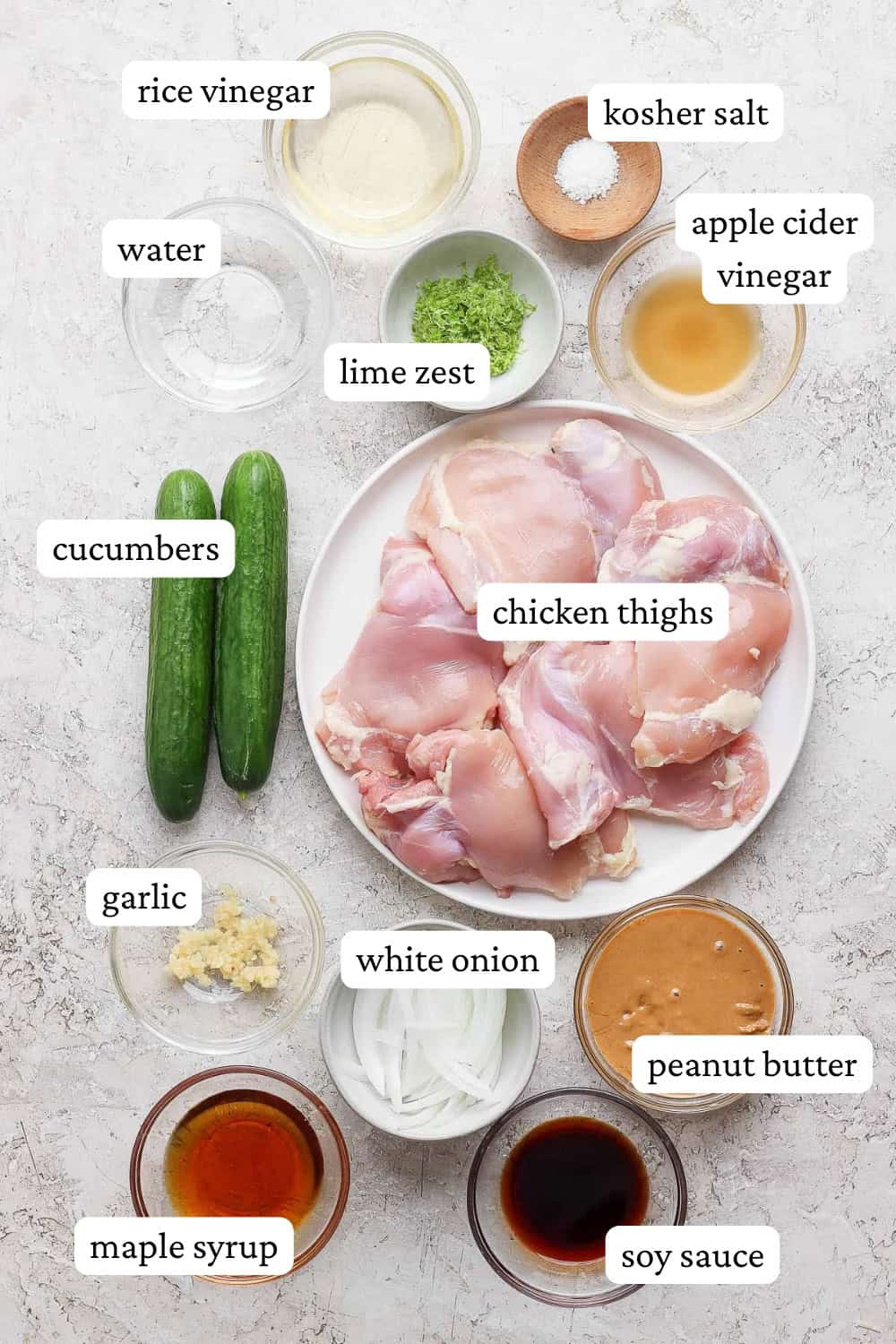 Ingredients for Thai chicken skewers in separate bowls with labels.