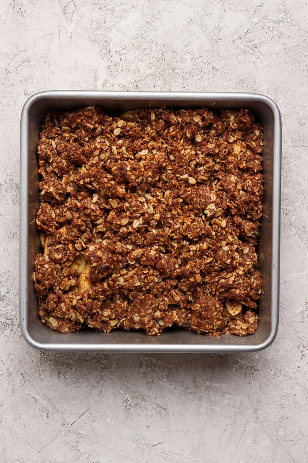 Healthy apple crisp in a baking pan after baking.