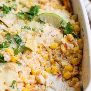 Street corn chicken casserole topped with cilantro, fresh lime, and cojita cheese.